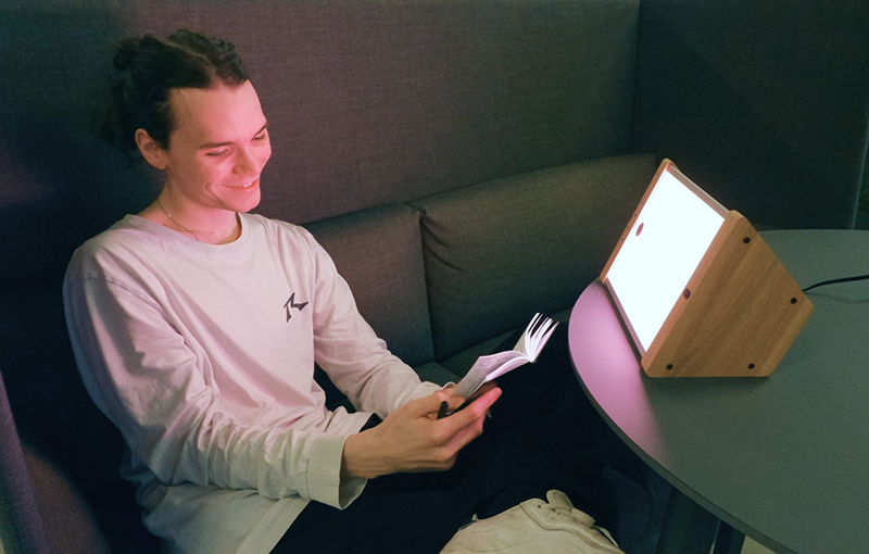 young man reading using EVY LIGHT