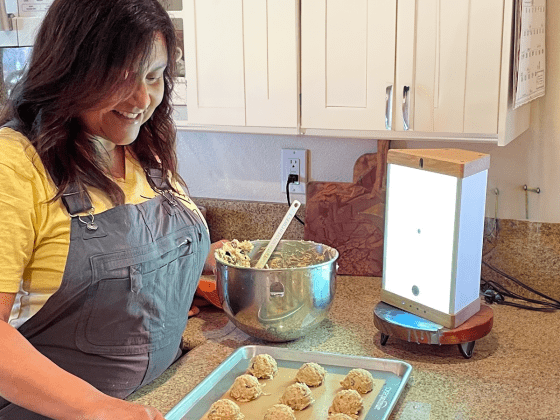 woman using EVY LIGHT while baking