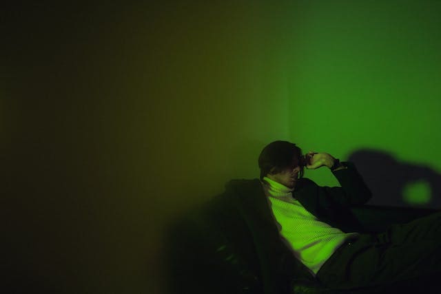 man-sitting-in-green-light-for-green-light-therapy-for-depression